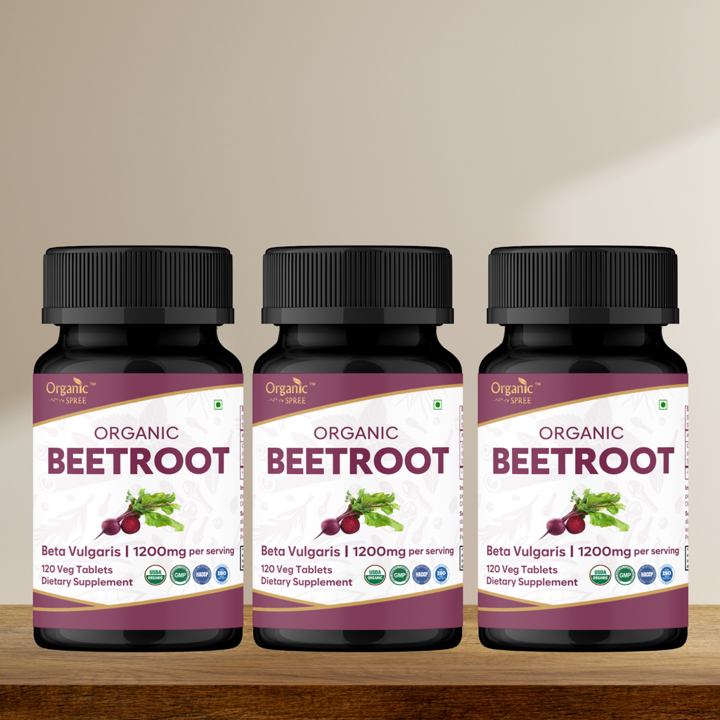 Three bottles of Organic Beetroot supplement on a wooden surface with a beige background
